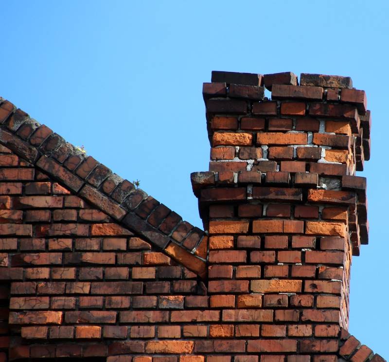 Damaged chimney on an Kensington home showing cracks and missing mortar